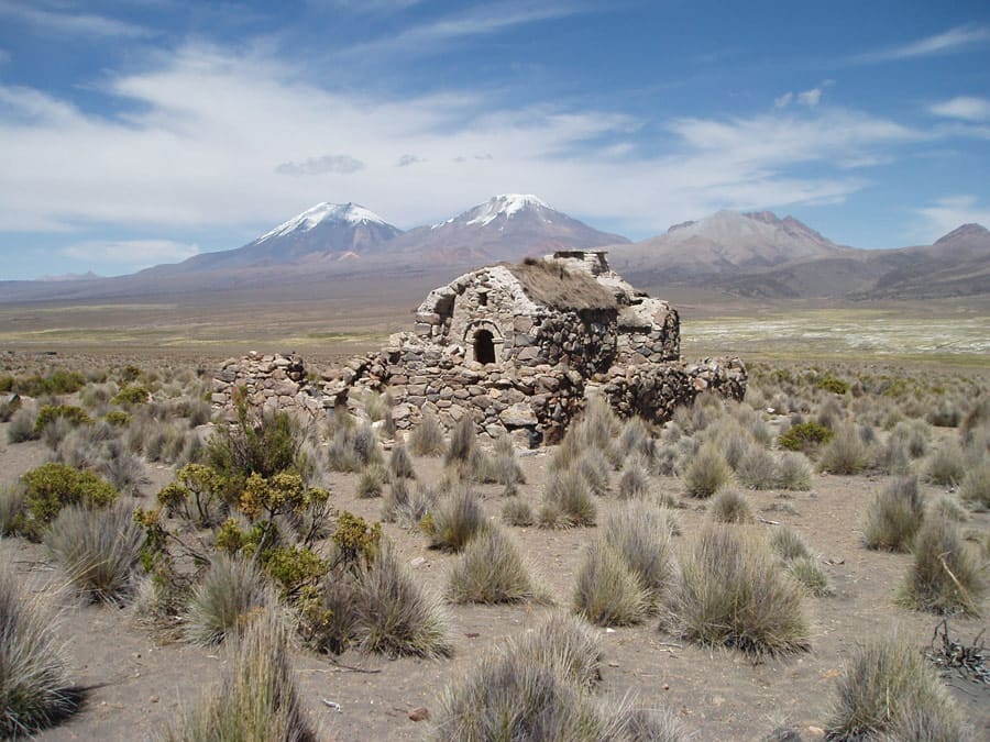 B48 Deserted house at Sajama with twin volcanos behind