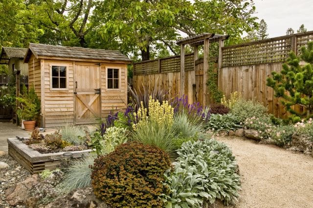 15 Backyard and Garden Shed Landscaping Ideas That Will Motivate You 8 rustic shed with matching fence