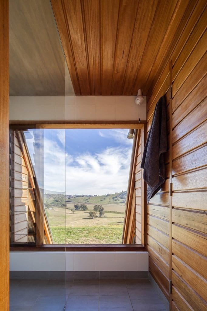This Elegant A-Frame Rental in Australia Lets You Reconnect With Nature in Style 11 even the bathroom comes with an expansive view