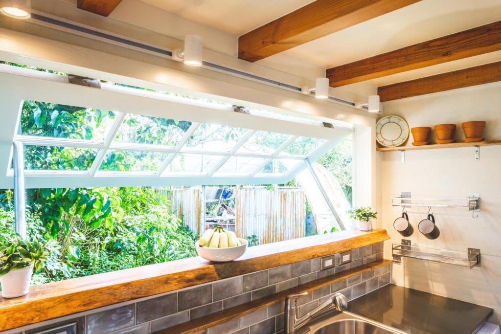 Maximizing Space in Style: A Modern Tiny House in Hawaii that Merges Nature and Design 4 The most impressive features of this modern tiny house in Hawaii is the functional windows installed in the kitchen
