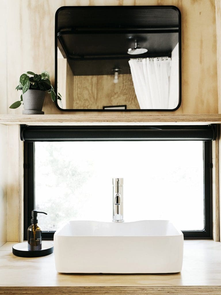 Tiny Cabin Retreat Reconnects Its Guests With Nature 10 Austin Texas Ryan McLaughlin Cabin bathroom vanity