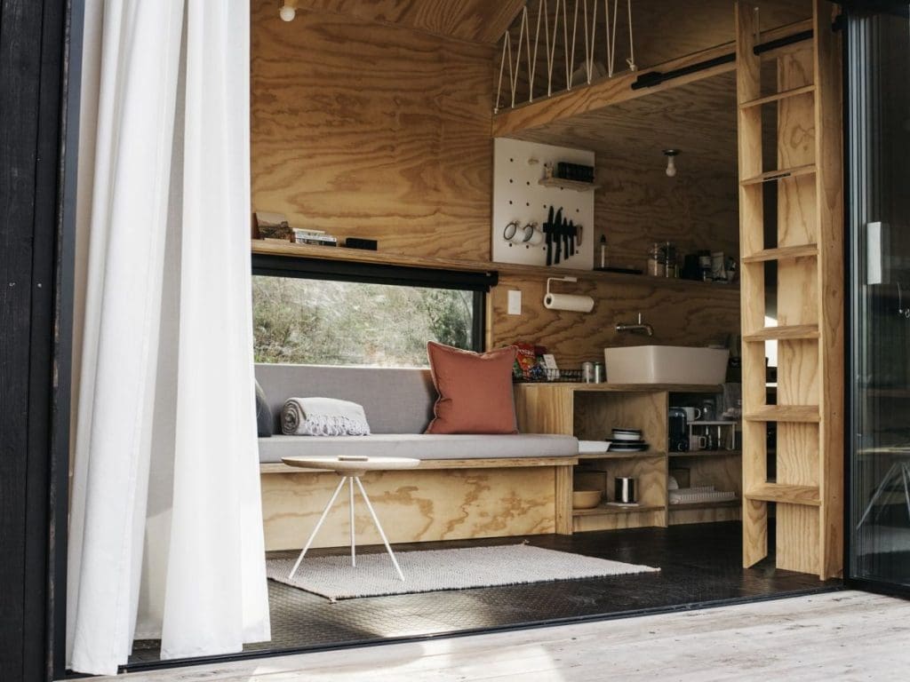 Tiny Cabin Retreat Reconnects Its Guests With Nature 4 Austin Texas Ryan McLaughlin Cabin plywood storage
