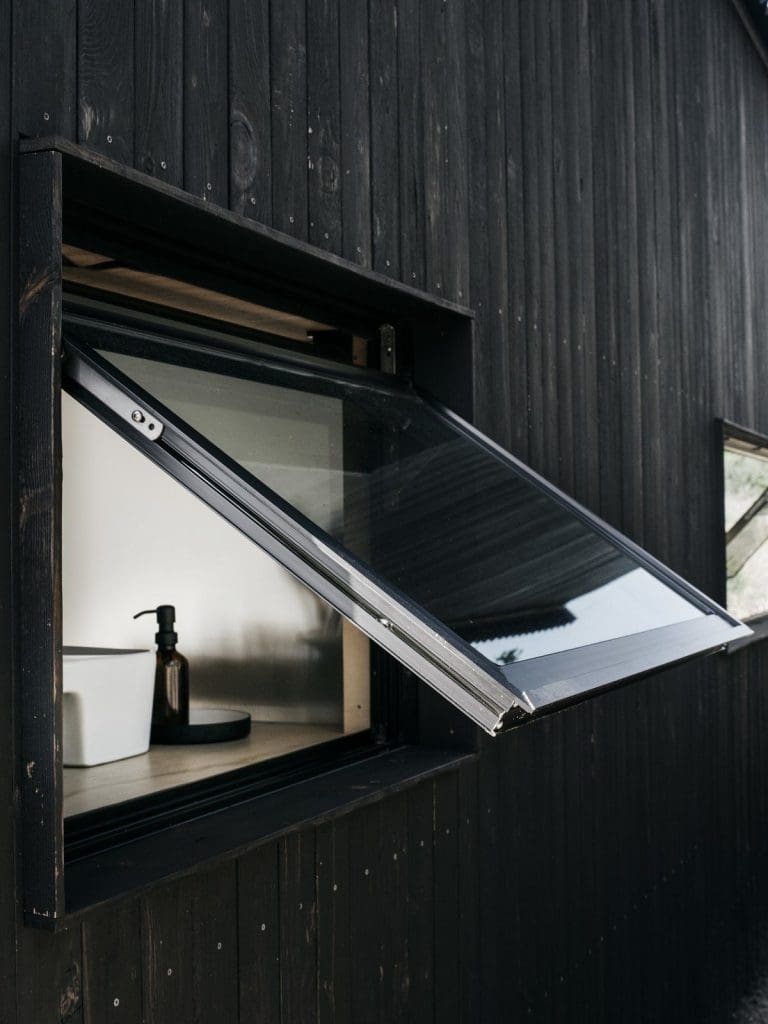 Tiny Cabin Retreat Reconnects Its Guests With Nature 11 Austin Texas Ryan McLaughlin Cabin window