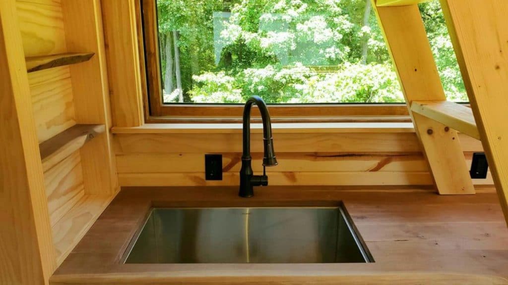 This WoodWorkers Dream Is A Tiny Houses On Wheels For Rustic Living 5 Woodworkers Cabin 3 1024x576 1