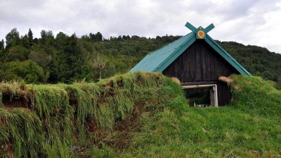 Earth and Turf Cabin 9 house by wall