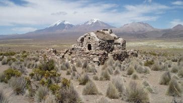 B48 Deserted house at Sajama with twin volcanos behind