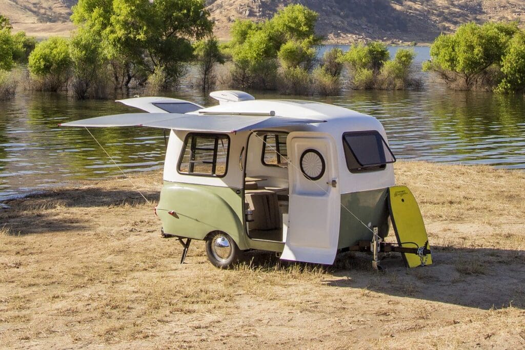 Runaway Campers: The Ultimate Guide 4 Runaway Campers: Your Gateway to Unforgettable Adventures: A well-equipped mini camper set up at a scenic location, illustrating the perfect balance of comfort and compactness.