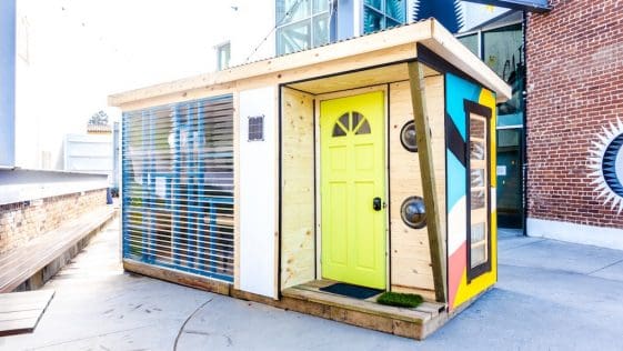 Cafam - A tiny cabin with bright colors painted to it