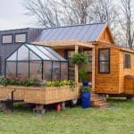 This Tiny Home Has A Greenhouse And A Porch Swing - The Elsa 33 This Tiny Home Has a Greenhouse and a Porch Swing