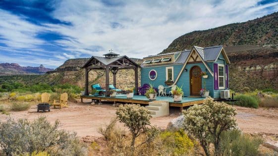 Mother Eve is airytale themed tiny house has a blue exterior and unique roofline.