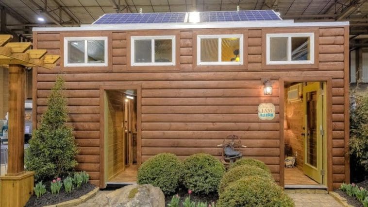 a shipping container tiny house with a rustic log cabin theme