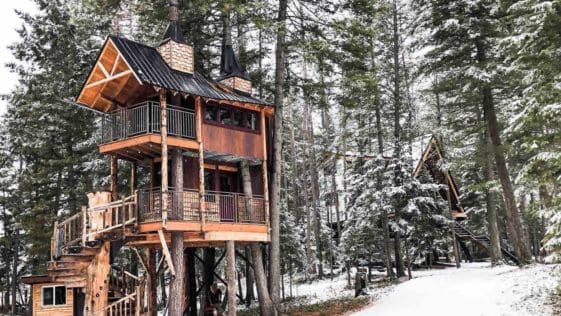 Take your fantasy of living in a cabin in the woods to new heights with a stay at this stunning, two-story treehouse retreat at the gateway to Glacier National Park in Montana.