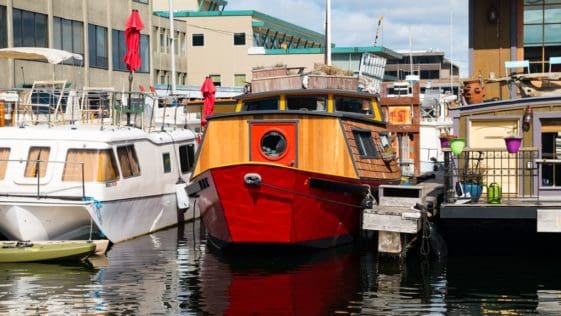 A charming turnkey houseboat currently docked off Westlake Avenue near Downtown Seattle.