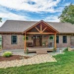 The modest exterior conceals a stunning interior with soaring 18-foot ceilings