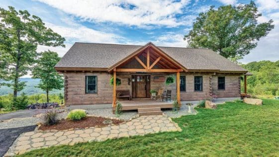 The modest exterior conceals a stunning interior with soaring 18-foot ceilings