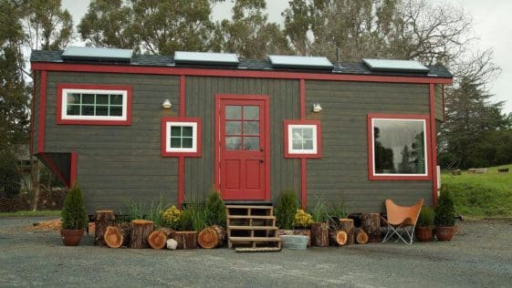 The Gem is a 173-square-foot tiny house with a bedroom platform and under floor storage.