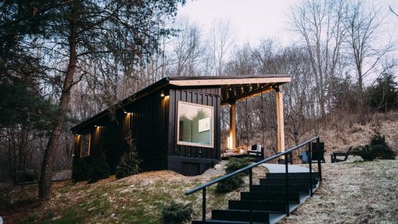 The Lily Pad is a 280-square-foot black-painted shipping container home located near Hocking Hills State Park in Ohio.