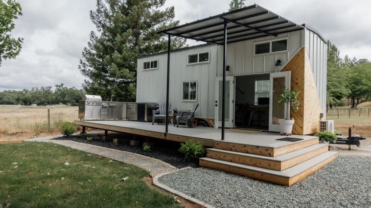 Tony and Charlotte Perez designed and built their own 280-square-foot home, which features an expansive deck off of the front facade.