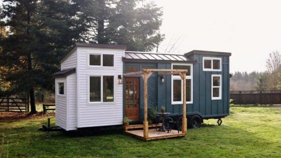 This 28' Tiny House Featuring The Main Level Bedroom With Murphy Bed That Converts Into The Dining Room
