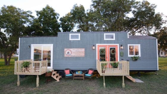The 384-square-foot tiny home has two steel slide-outs, a main floor master bedroom, and an additional 70-square-foot loft.