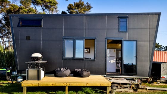This Couple Built An All-Black Tiny House Powered By Solar Panels, And It's Every Goth Kid's Dream