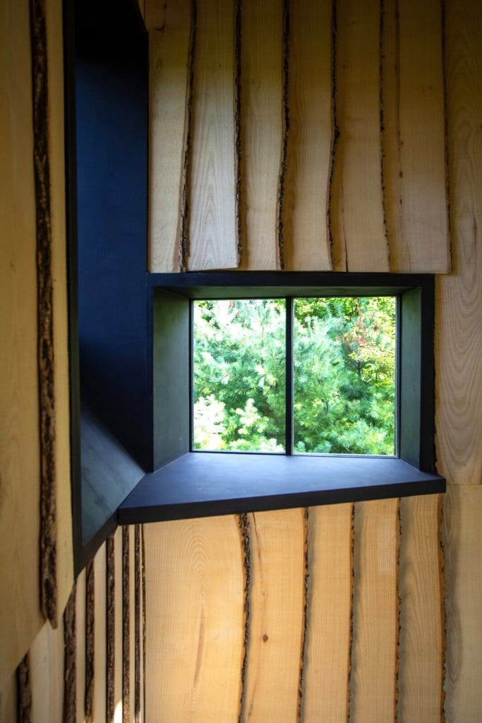 This Tiny 3D-Printed Cabin Makes a Big Statement About Sustainability 4 black painted plywood