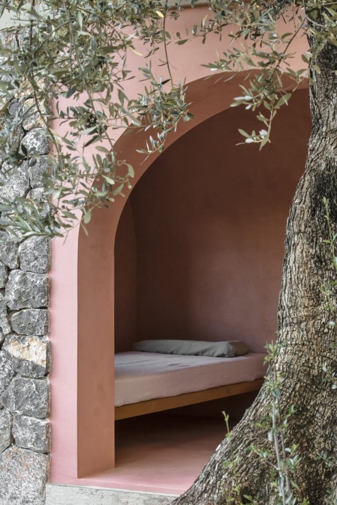 A Pair of Pink and Purple Tiny Houses Take Root in an Idyllic Olive Grove 2 the bedroom area