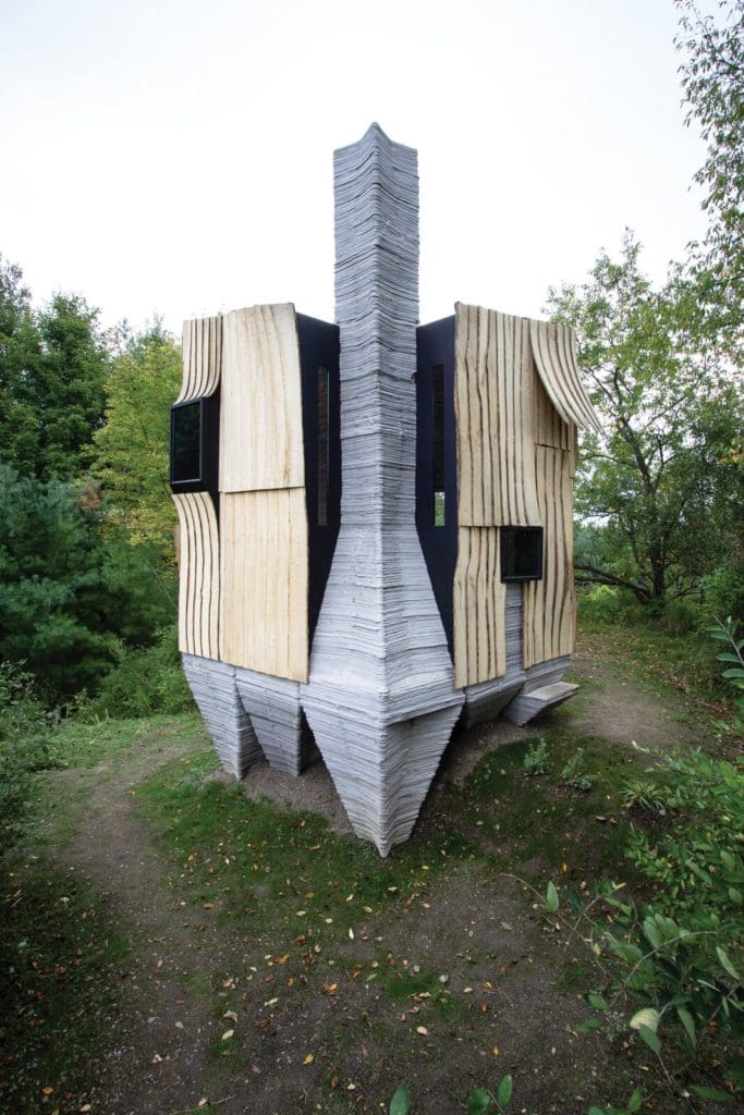This Tiny 3D-Printed Cabin Makes a Big Statement About Sustainability 1 the chimney too is made from horizontal layers of 3d printed concrete
