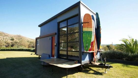 Built as a custom mobile surf shack for Santa Barbara, California residents, Amber and Tommy, this tiny house allows the couple to stay close to the beach where they enjoy surfing and rowing. The 300-square-foot tiny house was designed by Alex Wyndham and featured on Season 3, Episode 5 of Tiny House Nation.
