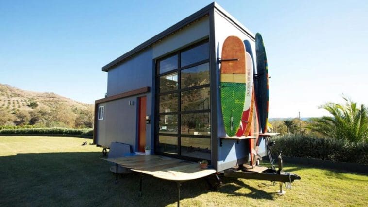 Built as a custom mobile surf shack for Santa Barbara, California residents, Amber and Tommy, this tiny house allows the couple to stay close to the beach where they enjoy surfing and rowing. The 300-square-foot tiny house was designed by Alex Wyndham and featured on Season 3, Episode 5 of Tiny House Nation.