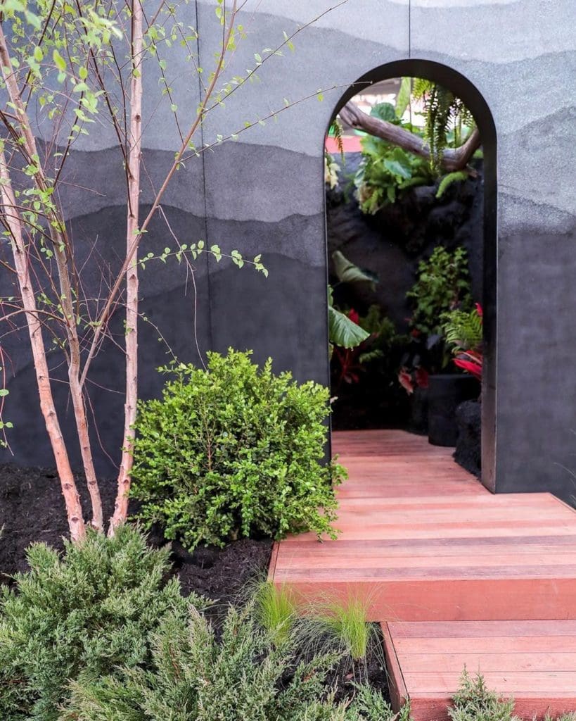 a small path and courtyard lead up to the house