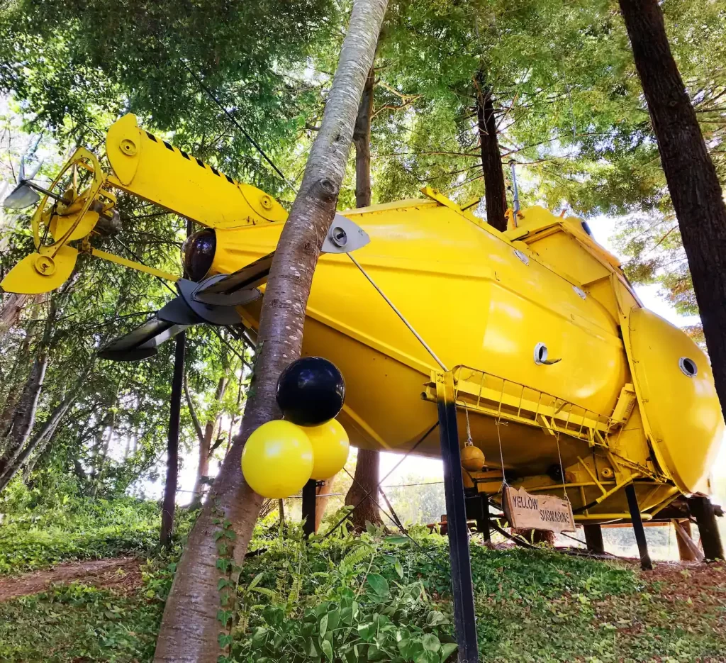 Yellow Submarine House: Dive into an Extraordinary Vacation Experience 1 Vibrant exterior of the Yellow Submarine Tiny House with its distinctive rounded design