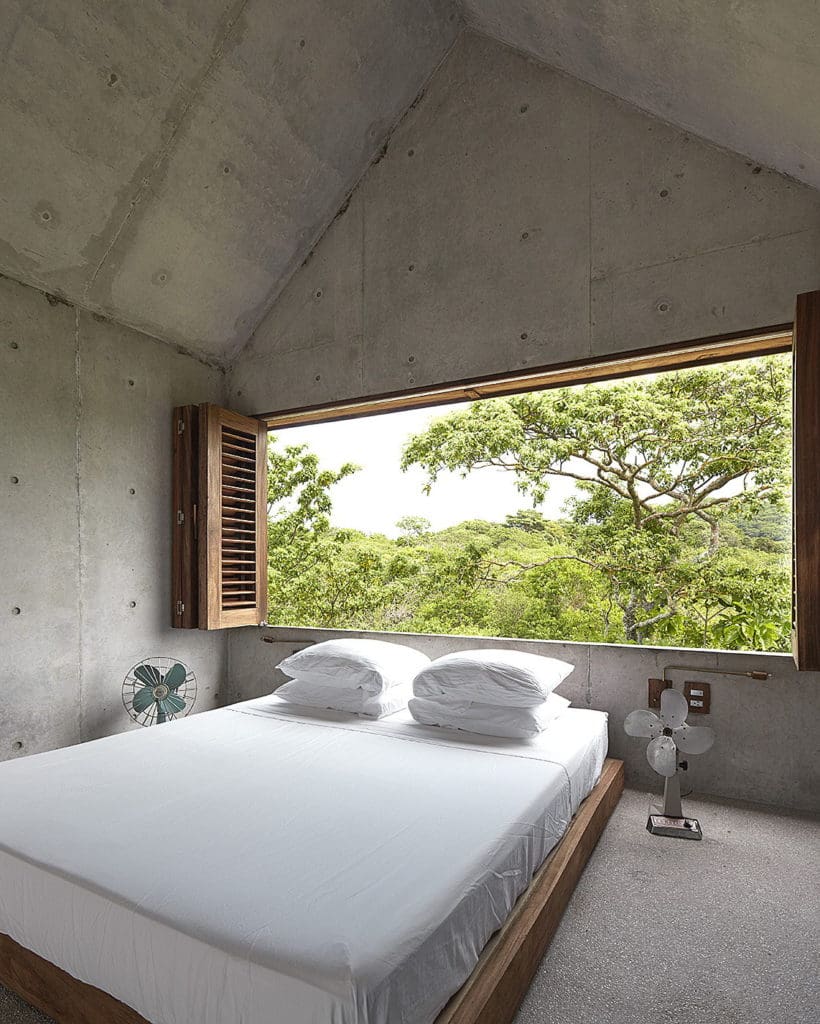 Find tranquility at Casa Tiny: A Beautiful Tiny House in Mexico 31 The masters bedroom at Casa Tiny - a beautiful tiny house in Mexico with its lush green view