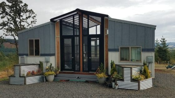 The Ohana a two - 24' Tiny Homes connected with a sunroom deck in between