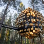 A captivating view of the Birdhouse Hotel Room's exterior, showcasing its 350 birdhouses nestled in the Swedish forest.