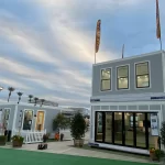 Boxabl Homes: The Future of Affordable Housing 12 A side-by-side comparison of a Boxabl home and a traditional house, illustrating the differences in construction methods and materials.