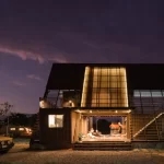 The Container Cabin at Oost-Kampville offering a serene escape amidst a tropical setting