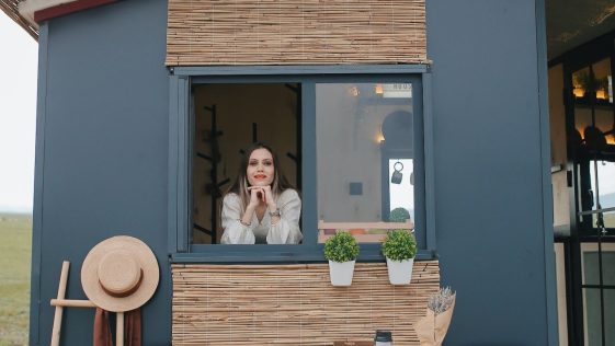 Woman Inside A Tiny House